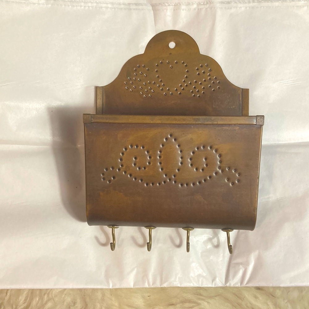 Copper key and mail holder.